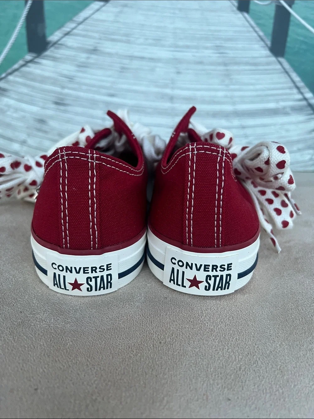 Converse Women's Low Top Sneakers in Burgundy with Heart-Print Laces